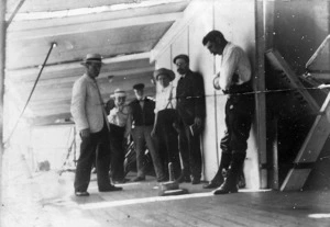 Men playing quoits on board ship
