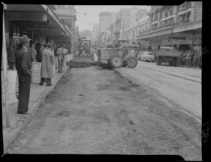Willis Street under construction, lots of people waiting on the side of the street for tram, Wellington