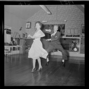 Mr Milton Mitchell and Mrs Jimmy James demonstrating rock & roll dancing, in a dance studio