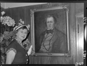 Irma O'Connor with a painted portrait of Edward Gibbon Wakefield