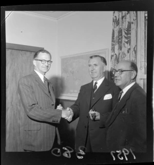 Prime Minister Sidney Holland with Cabinet Minister RG Gerard, left, and Mr J Rae, right