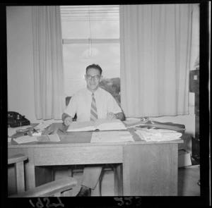 Unidentified man at his desk, Levin
