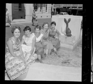 Girls cool off at civic fountain (caption), workers using the Wellington City Council water feature as a paddling pool
