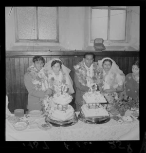 Two unidentified Indian couples cutting the cake at a wedding in Newtown, Wellington