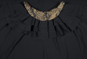 Maker unknown :[Neck and collar detail and flouncing below collar of cloak of Katherine Mansfield. Early twentieth century].