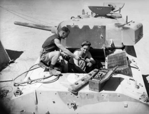 Soldiers at the 2nd NZEF, 4th Armoured Brigade workshops in Maadi, Cairo, Egypt, working on a Sherman tank turret