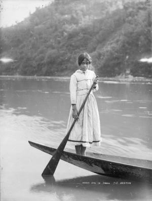 Unidentified Maori girl in a waka