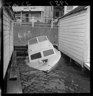 A damaged pleasure boat after a storm at Wellington