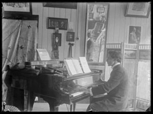 Room with man playing a piano