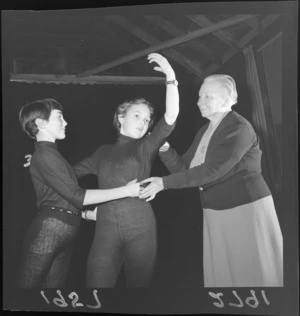 Miss Estelle Beere teaching dance movements to children at her Hill Street studio, Thorndon, Wellington