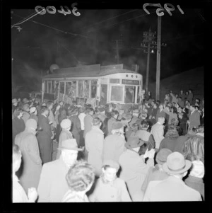 Farewell parade, final tram to Aro Street from Railway Station, Wellington, showing crowd on the street watching