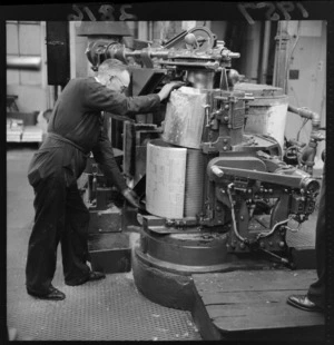 An unidentified man casting a stereotype plate at The Evening Post newspaper printing works, Willis Street, Wellington