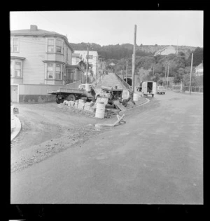 Constructing a traffic island at junction of Brougham Street and Paterson Street, Wellington, showing Mount Victoria Tunnel at the background