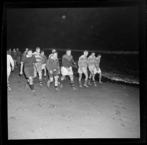 Wellington Rugby Union Football Club practising on a beach at night, Eastbourne, Lower Hutt City