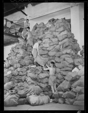 Bags of newspapers posted to troops and awaiting sorting, army post office, Cairo, Egypt, during World War II