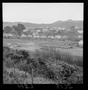 Tawa Flat School, Wellington, with a supply of large cement sewer pipes.