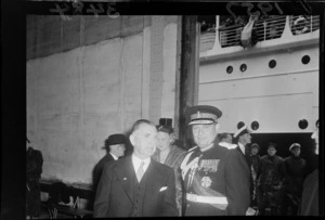 Prime Minister Sidney Holland meeting Governor-General Lord Cobham and Lady Cobham on their arrival at the Wharf, Wellington, including ship