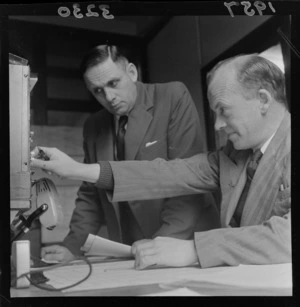 Two unidentified men at the control unit for the Paekakariki railway line