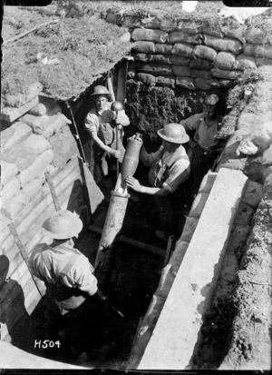 Soldiers loading a New Zealand trench mortar, near Colincamps, France