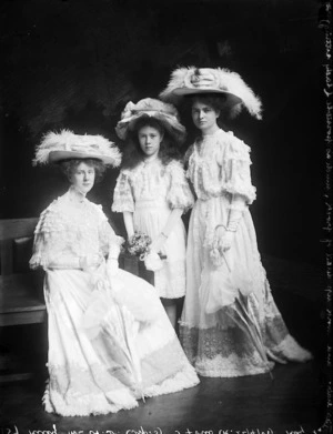 Three young women, probably of the Riley family, dressed in lace and hats