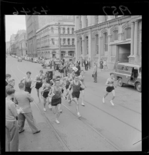 Auckland harriers running down a street to celebrate their anniversary