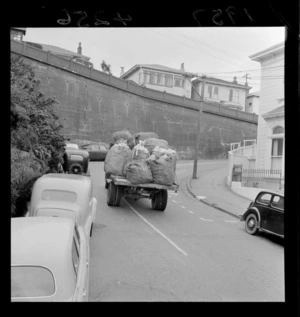 Truck hauling rubbish sacks on Boulcott Street, Wellington