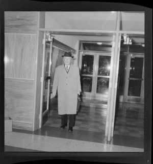 Walter Nash arriving at parliament for an election meeting