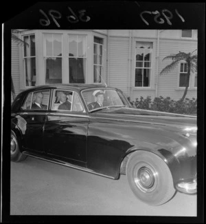Prime Minister Keith J Holyoake leaves Government House [with Alister McIntosh?] in a Rolls Royce