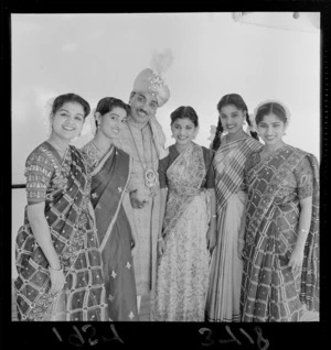 Indian magician in costume with assistants