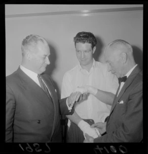 Keith Holyoake with Barry Brown and an unidentified man at the boxing match of Barry Brown versus Jimmy Newman, Wellington Town Hall