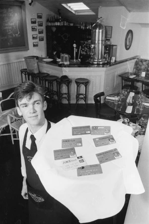 Campell Porter with a selection of credit cards - Photograph taken by John Nicholson