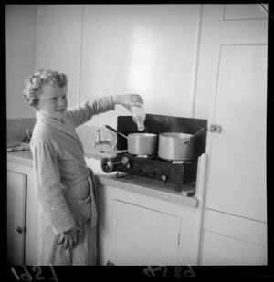 Robyn Short cooking breakfast on a camp stove