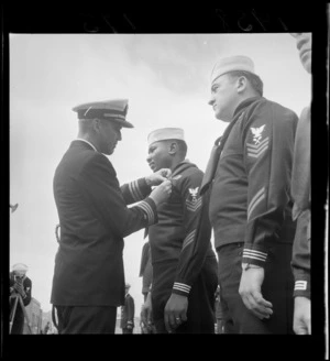 Presentation of decorations to sailors from the American navy
