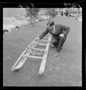Mr Arthur Helm with a forty year old sledge used by Dr Edward Wilson on his 'worst journey in the world' to visit the Emperor Penguins in the Antarctic, outside the Wellington Town Hall