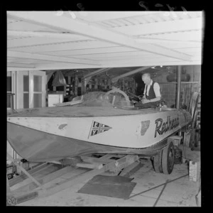 Len Southward working on the speedboat 'Redhead' in a shed
