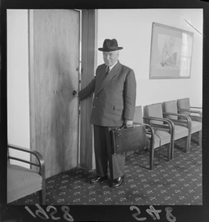 Prime Minister Walter Nash leaving his office for an overseas trip