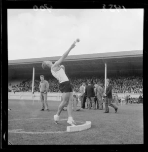 Unidentified male athlete competing in the shotput at Athletic Park, Wellington, for the Inter-Collegiate Sports competition