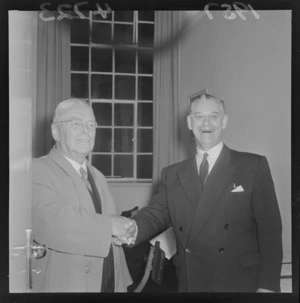 Walter Nash receiving congratulations from defeated Prime Minister Keith Holyoake, election night 30 November 1957