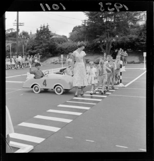 Traffic training, Karori School, Wellington, children learning to stop at a pedestrian crossing to allow people to cross the road safely