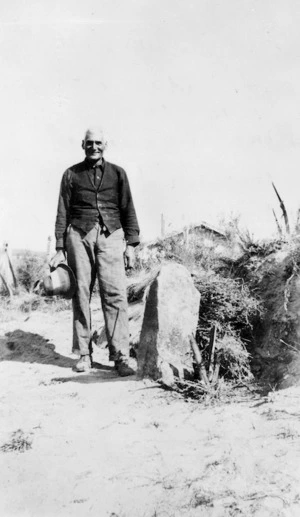 Ruhi Pururu standing next to a wishing stone
