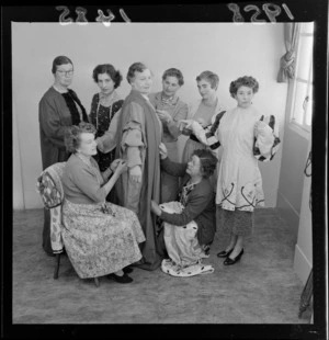 Group of unidentified women with a costume they are making for Thespian play