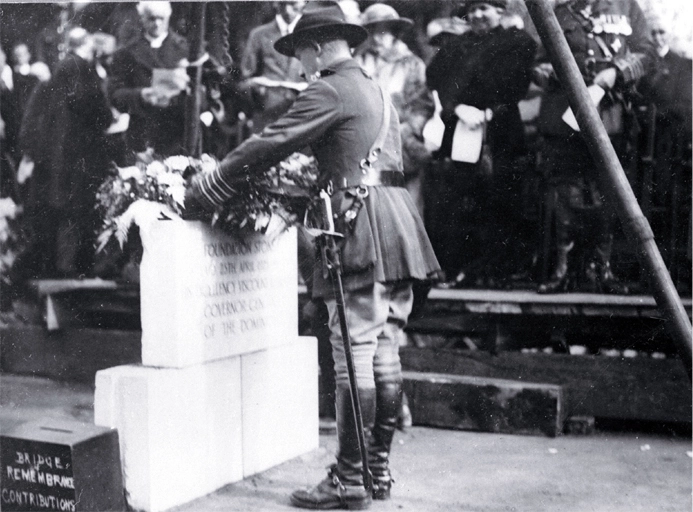 Colonel Hugh Stewart, President of the Christchurch Branch of the RSA places a wreath on the foundation stone, Bridge of Remembrance