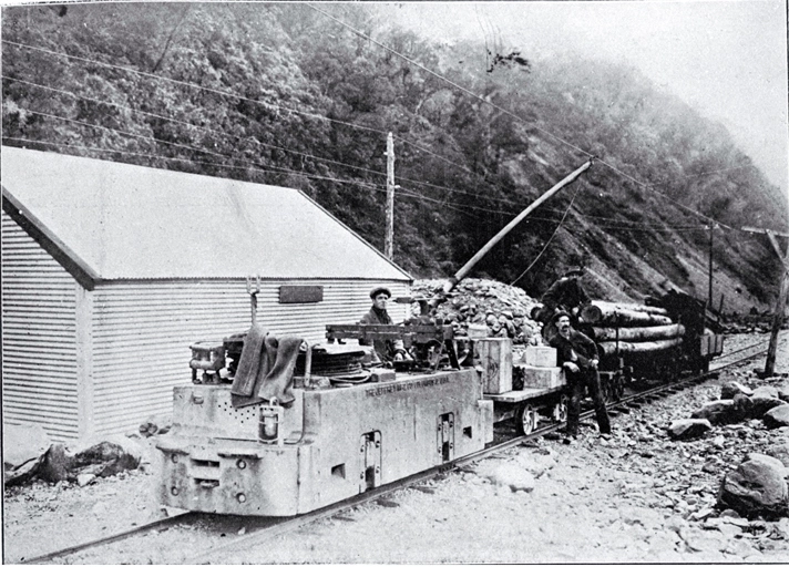 Electric locomotion with a train load of explosives and timber to be used in the construction of the Arthur's Pass Tunnel