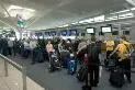 Passengers checking in at Air New Zealand, Brisbane International Airport, 1 July 2005 [picture] /