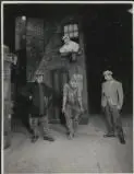 John Baskcomb as Alfred P. Doolittle and two unidentified performers in the J.C. Williamson production of My fair lady, act I, scene 2, tenement section, Tottenham Court Road, 1960 [picture] /
