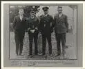 Portrait of T.H. McWilliam, Charles Kingsford Smith, Charles Ulm and H.A. Litchfield at Wigram Aerodrome, Christchurch, New Zealand, 11 September 1928 [picture] /