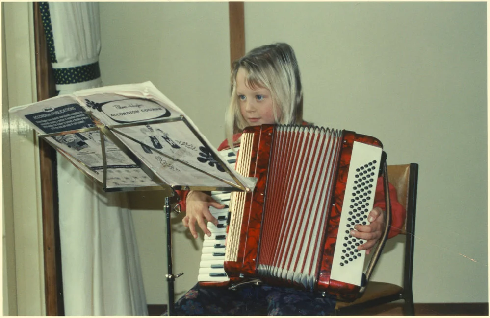 Child playing accordion
