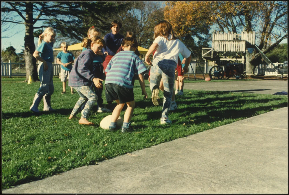 Children playing with rugby ball