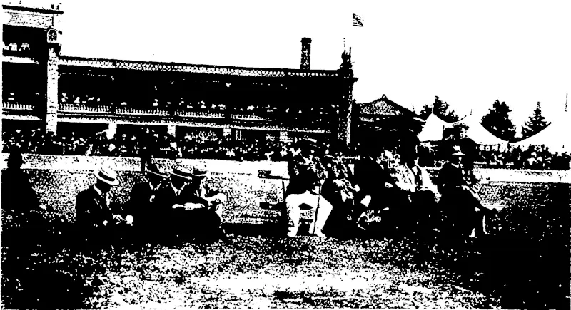 1) Competitors passing the grandstand xn the halt-mile u> A competitor jfter emeigirg from the back in the obstacle race (5) \V L. Colvin (fih yards) wins the Caledonian handicap,  THE JUDGES OF THE HIGHLAND DANCING AND BAGPIPE MUSIC,  (At the back of the seat the officer m charge of the Pioneer squad.; (Otago Witness, 09 January 1907)