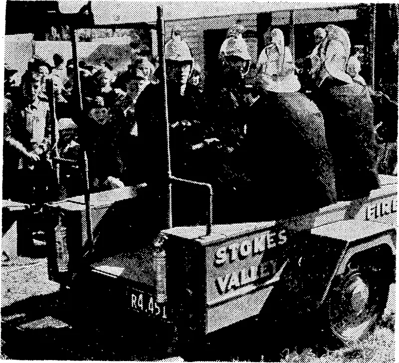 Evening Post" Photo. Trailer outfit built. by members of tlie Stokes: Valley Volunteer Fire Brigade, and manned by some members of the brigade, when the new fire station building was opened on Saturday by Mr. H. E. Combs, M.P. (Evening Post, 12 November 1940)